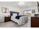 Comfortable bedroom featuring a large window, blue accents, and ceiling fan for added comfort at 4812 S Windstream Pl, Chandler, AZ 85249