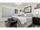 Serene bedroom features a plush bed, soft lighting, and stylish décor for a relaxing retreat at 4812 S Windstream Pl, Chandler, AZ 85249