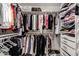 Organized walk-in closet featuring ample storage space for clothing and accessories at 4812 S Windstream Pl, Chandler, AZ 85249