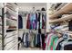 Well-organized closet showcasing clothing racks and built-in storage solutions at 4812 S Windstream Pl, Chandler, AZ 85249