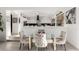 Chic dining area with a glass-top table open to the kitchen and modern decor at 4812 S Windstream Pl, Chandler, AZ 85249