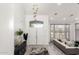 Elegant entryway with a chandelier, console table, and a view into the spacious living room at 4812 S Windstream Pl, Chandler, AZ 85249