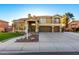 Stunning two-story home features a three-car garage and beautifully landscaped front yard at 4812 S Windstream Pl, Chandler, AZ 85249