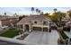 Charming two-story home with manicured lawn, mature trees, and a spacious three-car garage at 4812 S Windstream Pl, Chandler, AZ 85249