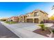 Attractive two-story home with a three-car garage, manicured landscaping, and inviting curb appeal at 4812 S Windstream Pl, Chandler, AZ 85249