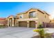 Charming two-story home featuring a three-car garage, well-kept landscaping, and a clear blue sky at 4812 S Windstream Pl, Chandler, AZ 85249