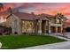 Stunning home exterior with manicured lawn, mature trees, and a grand entrance at 4812 S Windstream Pl, Chandler, AZ 85249