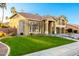 Well-maintained front yard with lush green lawn and a view of the spacious two-story home at 4812 S Windstream Pl, Chandler, AZ 85249