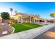 Beautifully landscaped front yard featuring mature trees and a charming two-story home at 4812 S Windstream Pl, Chandler, AZ 85249