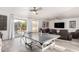 Spacious game room with a ping pong table, multiple seating options and a large sliding glass door at 4812 S Windstream Pl, Chandler, AZ 85249