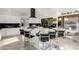 Bright kitchen featuring a large island, stainless steel appliances, and modern black and white design at 4812 S Windstream Pl, Chandler, AZ 85249