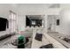 Spacious living room with a bar area, modern furniture, and stylish decor at 4812 S Windstream Pl, Chandler, AZ 85249