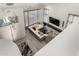 Aerial view of the well-lit living room with contemporary furniture and large windows at 4812 S Windstream Pl, Chandler, AZ 85249