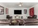Comfortable living room with leather recliners, television, and colorful accents at 4812 S Windstream Pl, Chandler, AZ 85249