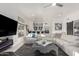 Bright living room with a large sectional sofa and stylish decor, including a bar area at 4812 S Windstream Pl, Chandler, AZ 85249