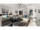 Bright living room with large sectional sofa, artwork, and stylish decor at 4812 S Windstream Pl, Chandler, AZ 85249
