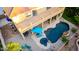 An aerial view of the backyard pool and spa, shaded patio area, and convenient second story balcony at 4812 S Windstream Pl, Chandler, AZ 85249