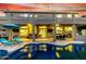 Inviting outdoor living space with a covered patio, lounge chairs, and a sparkling pool at 4812 S Windstream Pl, Chandler, AZ 85249