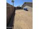 Fenced backyard features an alley access point and ample space at 4924 W Catalina Dr, Phoenix, AZ 85031