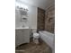 A full bathroom featuring a modern vanity, and a bathtub with a tiled wall at 4924 W Catalina Dr, Phoenix, AZ 85031