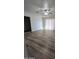 Bright bedroom with wood-look flooring, large windows, and a closet at 4924 W Catalina Dr, Phoenix, AZ 85031