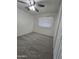 Bedroom with neutral carpet, a ceiling fan, and a window bringing in natural light at 4924 W Catalina Dr, Phoenix, AZ 85031
