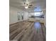 Open-concept living space with a kitchen view, great natural light, and wood-style flooring at 4924 W Catalina Dr, Phoenix, AZ 85031