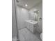 Bathroom featuring white cabinets, modern black fixtures, and a pristine mirror at 5201 N 61St Dr, Glendale, AZ 85301