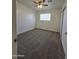 Bedroom with plush carpet, window with blinds, and ample space at 5201 N 61St Dr, Glendale, AZ 85301