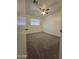 Bright bedroom features neutral carpet, ceiling fan, and window with blinds at 5201 N 61St Dr, Glendale, AZ 85301