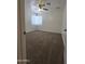 Bright bedroom with ceiling fan, window with blinds, and comfortable carpet flooring at 5201 N 61St Dr, Glendale, AZ 85301