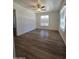 Bright bedroom with natural light, ceiling fan, and new floors at 5201 N 61St Dr, Glendale, AZ 85301