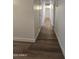 Hallway with updated flooring and neutral paint at 5201 N 61St Dr, Glendale, AZ 85301