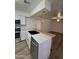 Bright eat in kitchen with stainless steel appliances and breakfast bar at 5201 N 61St Dr, Glendale, AZ 85301