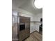 Beautiful kitchen with stainless steel appliances, white cabinets and breakfast bar at 5201 N 61St Dr, Glendale, AZ 85301
