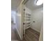 Laundry room area with built-in shelves and hookups for a washer and dryer at 5201 N 61St Dr, Glendale, AZ 85301