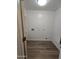 Laundry area with hookups for a washer and dryer and durable wood-look floors at 5201 N 61St Dr, Glendale, AZ 85301