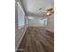 Large, bright living room with hardwood flooring, ceiling fans, and windows for plenty of natural light at 5201 N 61St Dr, Glendale, AZ 85301