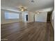 Bright living room with new hardwood flooring featuring a view of the front door and other living spaces at 5201 N 61St Dr, Glendale, AZ 85301