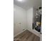 Utility closet with a hot water heater, hookups for a washer, and durable floors at 5201 N 61St Dr, Glendale, AZ 85301