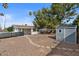 Backyard featuring a shed, spacious area, and drought resistant landscaping at 639 N 57Th Pl, Mesa, AZ 85205