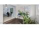 Additional bedroom featuring natural light and an accent wall with potted plants at 639 N 57Th Pl, Mesa, AZ 85205