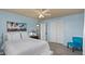 Bright bedroom with natural light, ceiling fan, and a view to the connected bathroom at 639 N 57Th Pl, Mesa, AZ 85205