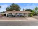 Charming single-story home with desert landscaping, covered carport, and inviting curb appeal at 639 N 57Th Pl, Mesa, AZ 85205