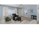 Open-concept living space offering hard wood floors, natural light, and a ceiling fan at 639 N 57Th Pl, Mesa, AZ 85205