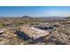 Bird's eye view of a home under construction within a vast, picturesque community landscape at 7646 E Hidden Canyon St, Mesa, AZ 85207