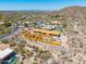 An aerial of desert home under construction with wood framing, in a beautiful neighborhood at 7646 E Hidden Canyon St, Mesa, AZ 85207