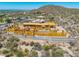 Home under construction with wood framing, featuring desert landscaping and scenic mountain views at 7646 E Hidden Canyon St, Mesa, AZ 85207
