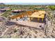 Home under construction with wood framing, featuring desert landscaping and brick work around base at 7646 E Hidden Canyon St, Mesa, AZ 85207