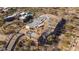 Aerial view of a home under construction, showcasing the foundation and framing in a desert setting at 7646 E Hidden Canyon St, Mesa, AZ 85207